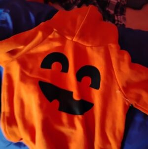 Orange Hoodie Onesie for an infant with Black Pumpkin Face